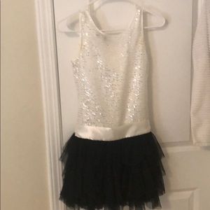 White sparkly top black layered frill bottom